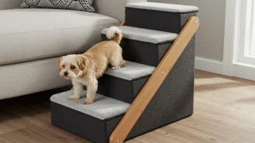 Small dog using indoor pet stairs to climb onto a couch safely and comfortably
